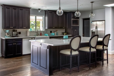 Black kitchen cabinets with kitchen island and more