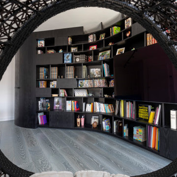 Une bibliothèque singulière dans une pièce de vie agrandie