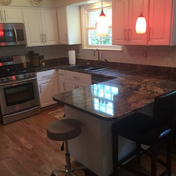 cabinet refacing with glass tile backsplash