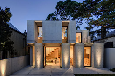 Contemporary two-storey concrete exterior in Sydney with a flat roof.