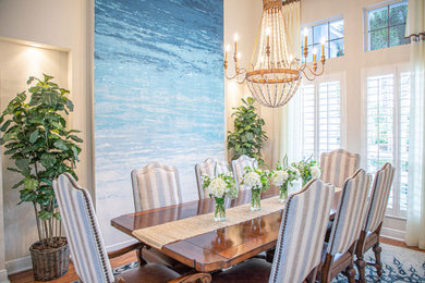 Enclosed dining room - mid-sized coastal medium tone wood floor enclosed dining room idea in Tampa with multicolored walls and no fireplace