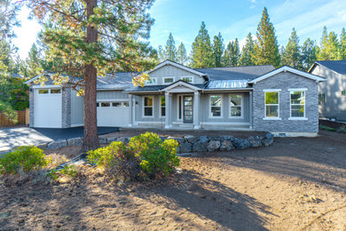 Example of a mid-sized minimalist gray one-story house exterior design in Other with a black roof