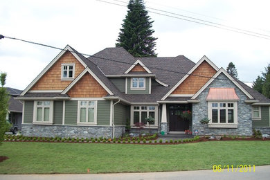 Inspiration for a mid-sized craftsman green two-story concrete fiberboard gable roof remodel in Vancouver