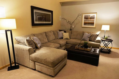 Mid-sized transitional enclosed carpeted and beige floor family room photo in Denver with gray walls, a standard fireplace, a wood fireplace surround and a wall-mounted tv