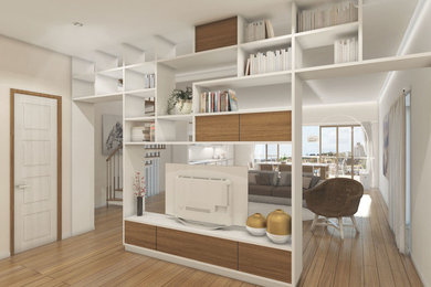 Immagine di un soggiorno minimal stile loft con libreria, pareti beige, parquet chiaro, parete attrezzata e pavimento marrone