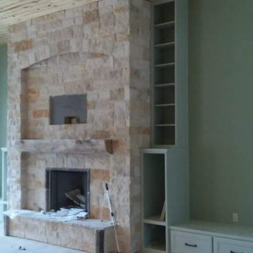 Custom Stone Fireplace Built-Ins with Tall Narrow Bookcase & Hearth Bench