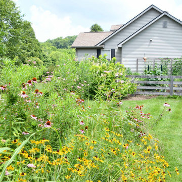 Cohesiveness was created by repeating massed native perennials and shrubs.