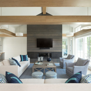 Inspiration for a coastal light wood floor family room remodel in Minneapolis with white walls, a ribbon fireplace and a wall-mounted tv