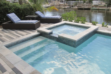 Island style pool photo in Tampa
