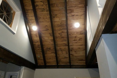 Living room - transitional medium tone wood floor living room idea in New York with gray walls