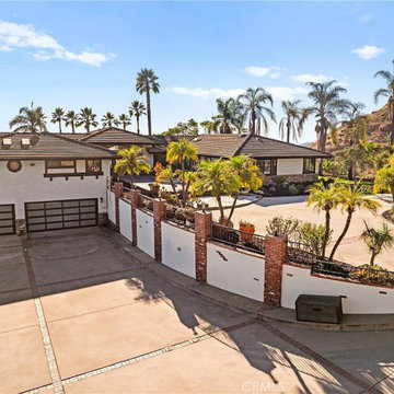 Grand Estate Entrance with Palm Trees