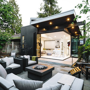This is an example of a scandinavian patio in Portland with a fire feature.