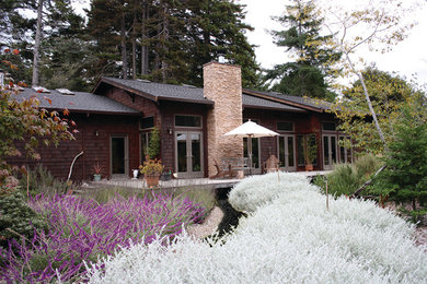 Inspiration for a large craftsman brown one-story wood exterior home remodel in Other with a shingle roof