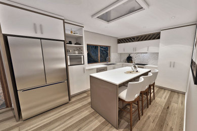 Design ideas for a large contemporary l-shaped separate kitchen in Central Coast with a double-bowl sink, flat-panel cabinets, yellow cabinets, quartz benchtops, subway tile splashback, stainless steel appliances, laminate floors and with island.