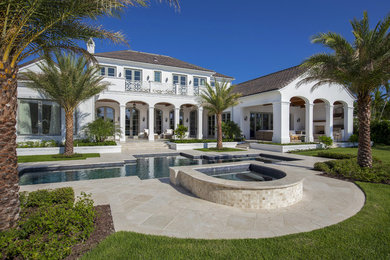 Example of an island style home design design in Miami