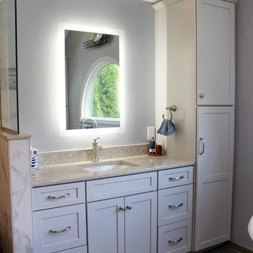 Gray Vanity with Freestanding Tub and Tiled Walkin Shower