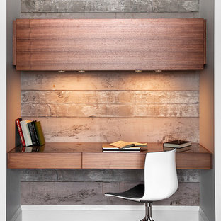 Design ideas for a medium sized modern study in Toronto with brown walls, dark hardwood flooring and a built-in desk.