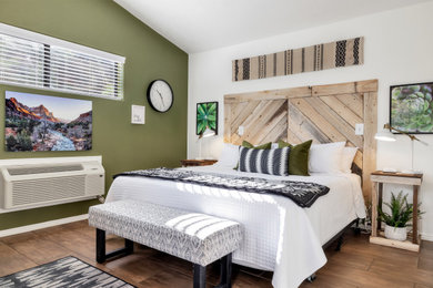Bedroom - mid-sized contemporary guest vinyl floor and brown floor bedroom idea in Salt Lake City with green walls