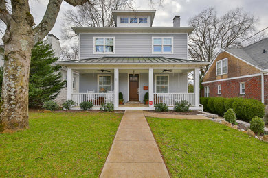 Mid-sized transitional gray three-story wood exterior home photo in Nashville with a metal roof