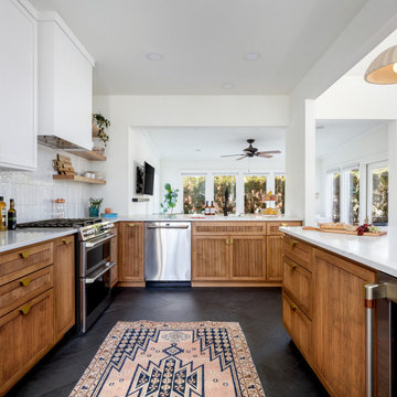 Open Kitchen Layout with Stained Reeded Cabinets & White Countertops