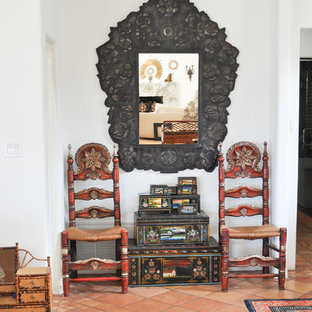 This is an example of a mediterranean living room in Los Angeles with porcelain flooring.