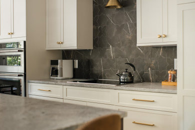 Mid-sized trendy galley eat-in kitchen photo in Charleston with shaker cabinets, white cabinets, granite countertops, gray backsplash, ceramic backsplash, stainless steel appliances, an island and gray countertops