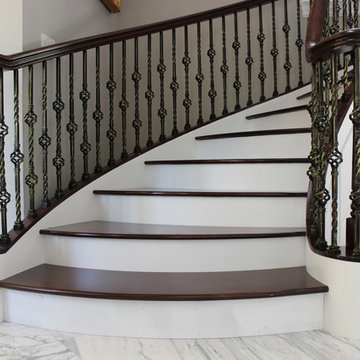 Walnut Circular Stair with Twist & Basket Iron Balusters