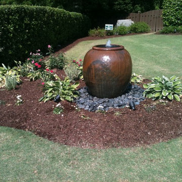 Fountainscapes / Urn Fountain with Accent Landscaping