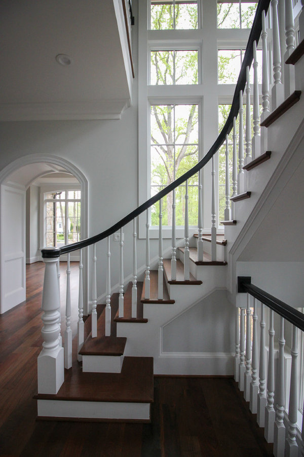 Powerful Impression by Floating Staircase in Suburban Foyer