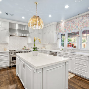 Bright and Elegant Kitchen with Glass Dining Table and Custom Cabinetry