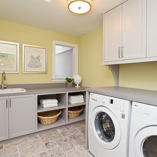 This is an example of a classic utility room in Minneapolis with yellow walls, grey floors and grey worktops.