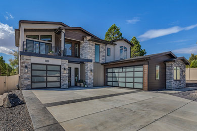 Example of a mid-sized transitional beige two-story mixed siding exterior home design in Other with a shingle roof and a black roof