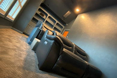 Home theater - transitional home theater idea in Houston