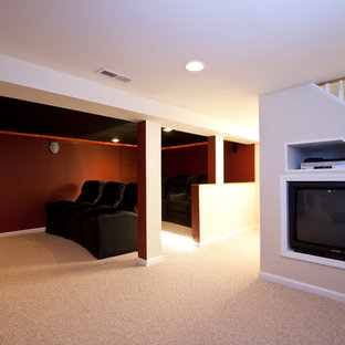 Large traditional open plan home cinema in Newark with red walls, carpet and a built-in media unit.