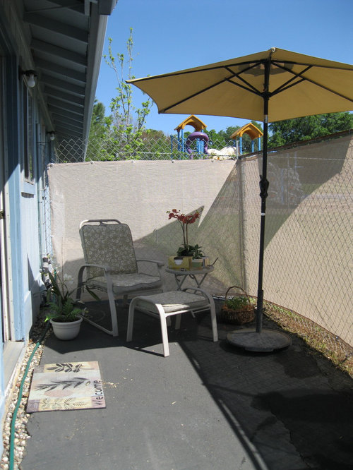 Shade cloth on wire fence. Our back patio project.