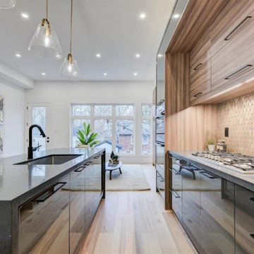 Custom Kitchen cabinetry with gold backsplash