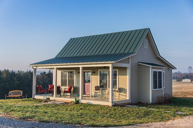 Mid-sized country beige one-story wood exterior home photo in Richmond