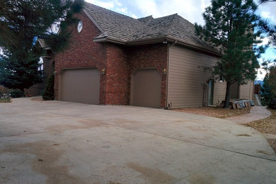 Large two-story wood exterior home photo in Other