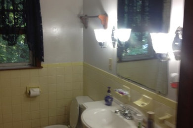 Example of a small trendy beige tile and mosaic tile porcelain tile alcove shower design in Bridgeport with an undermount sink, shaker cabinets, dark wood cabinets, granite countertops, a two-piece toilet and beige walls
