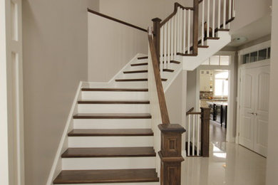 Inspiration for a timeless wooden l-shaped staircase remodel in Toronto