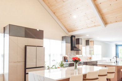 Example of a large mid-century modern multicolored floor, vaulted ceiling and linoleum floor eat-in kitchen design in Baltimore with medium tone wood cabinets, quartz countertops, two islands, flat-panel cabinets and white countertops