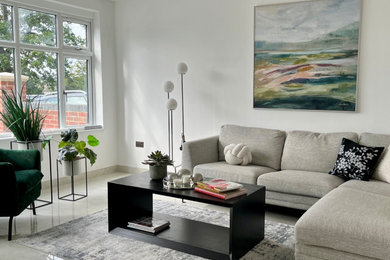 Inspiration for a large contemporary enclosed living room in Hertfordshire with white walls, ceramic flooring and grey floors.