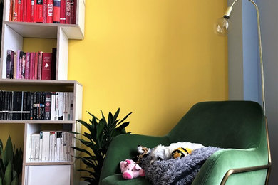 Photo of a medium sized modern open plan living room in London with a reading nook, multi-coloured walls, light hardwood flooring and brown floors.
