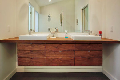 Bathroom - modern master double-sink bathroom idea in Santa Barbara with flat-panel cabinets, medium tone wood cabinets and a floating vanity