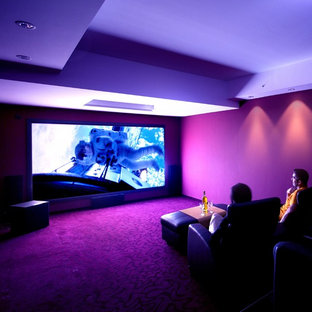 Mid-sized trendy enclosed carpeted home theater photo in Cologne with red walls and a projector screen