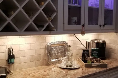 Inspiration for a timeless home bar remodel in New Orleans