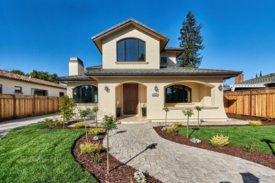 Example of a tuscan beige two-story house exterior design in San Francisco
