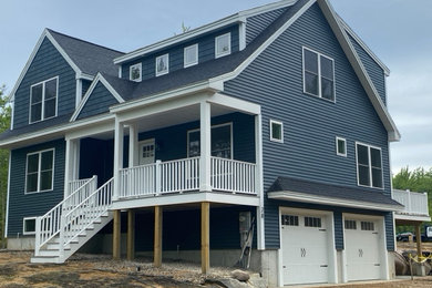 Example of a large arts and crafts home design design in Portland Maine