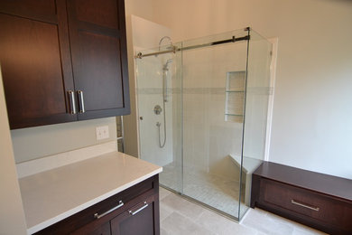 Bathroom - mid-sized traditional master white tile and porcelain tile porcelain tile and white floor bathroom idea in St Louis with shaker cabinets, brown cabinets, a two-piece toilet, gray walls, an undermount sink, quartzite countertops and white countertops