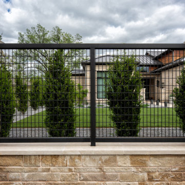 Custom Metal Fence & Electric Driveway Gate with Stone Accents